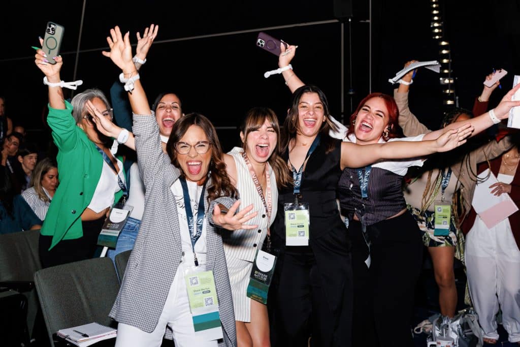 Group of attendees celebrating during an awards ceremony, captured by a corporate event photographer.