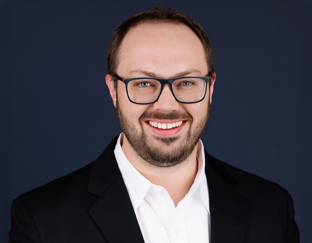 Professional leadership portrait of an executive in a corporate setting