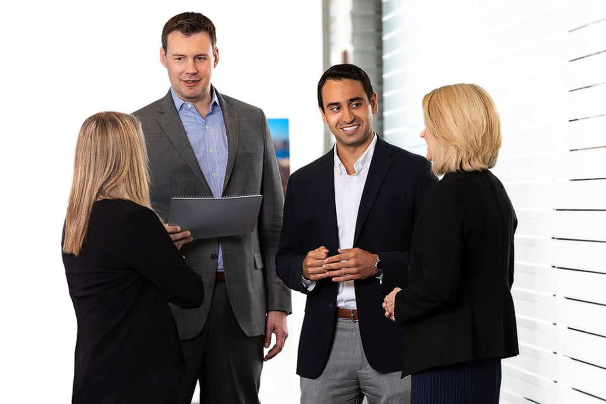 Corporate lifestyle photography of business professionals reviewing information together during a workplace discussion