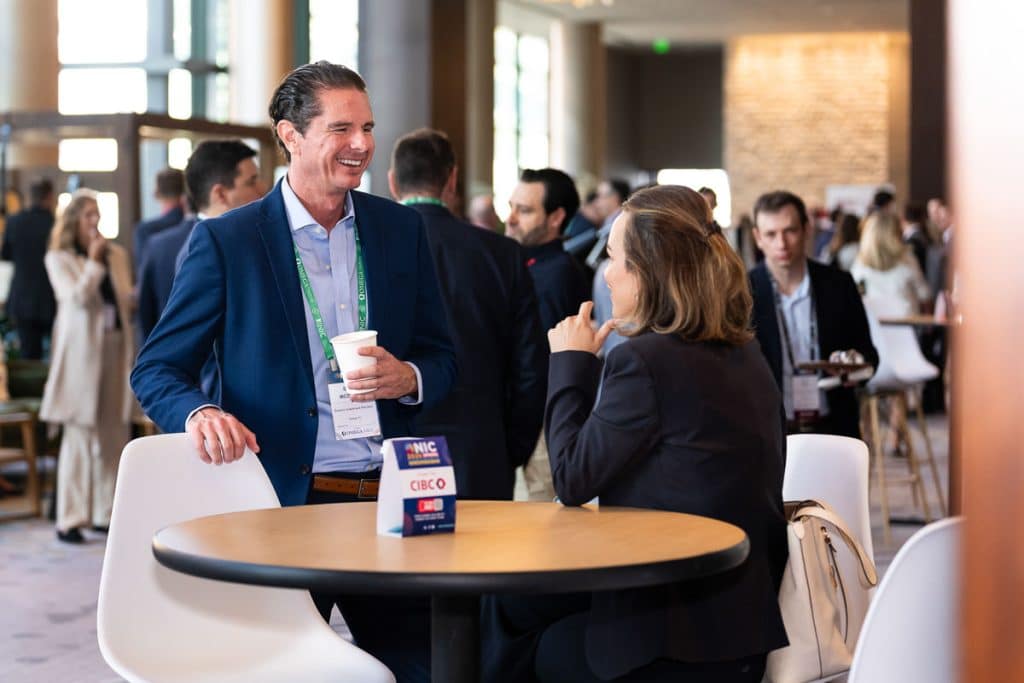 Attendees participate in a tasting station during a Chicago corporate conference. Tori Soper Photography provides corporate event photography for conferences, networking events, trade shows, sponsor activations, and experiential events in Chicago and nationwide.