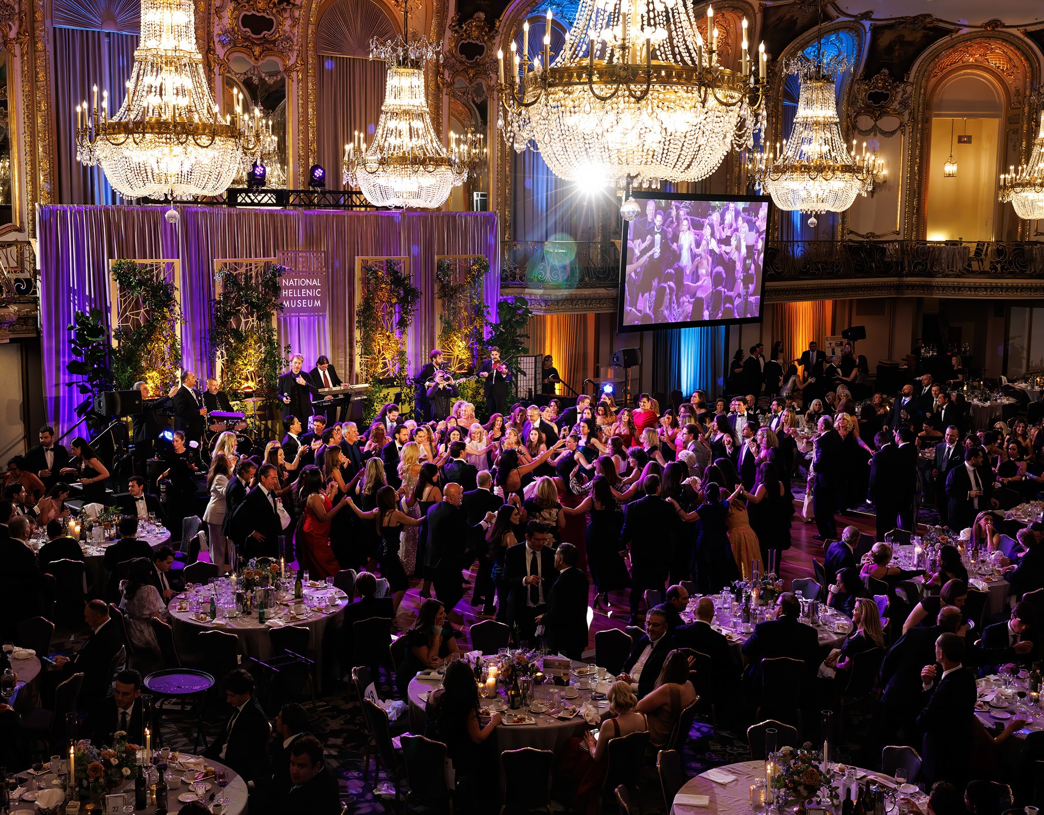 Chicago corporate event photographer capturing large gala in ballroom with stage, lighting, and audience