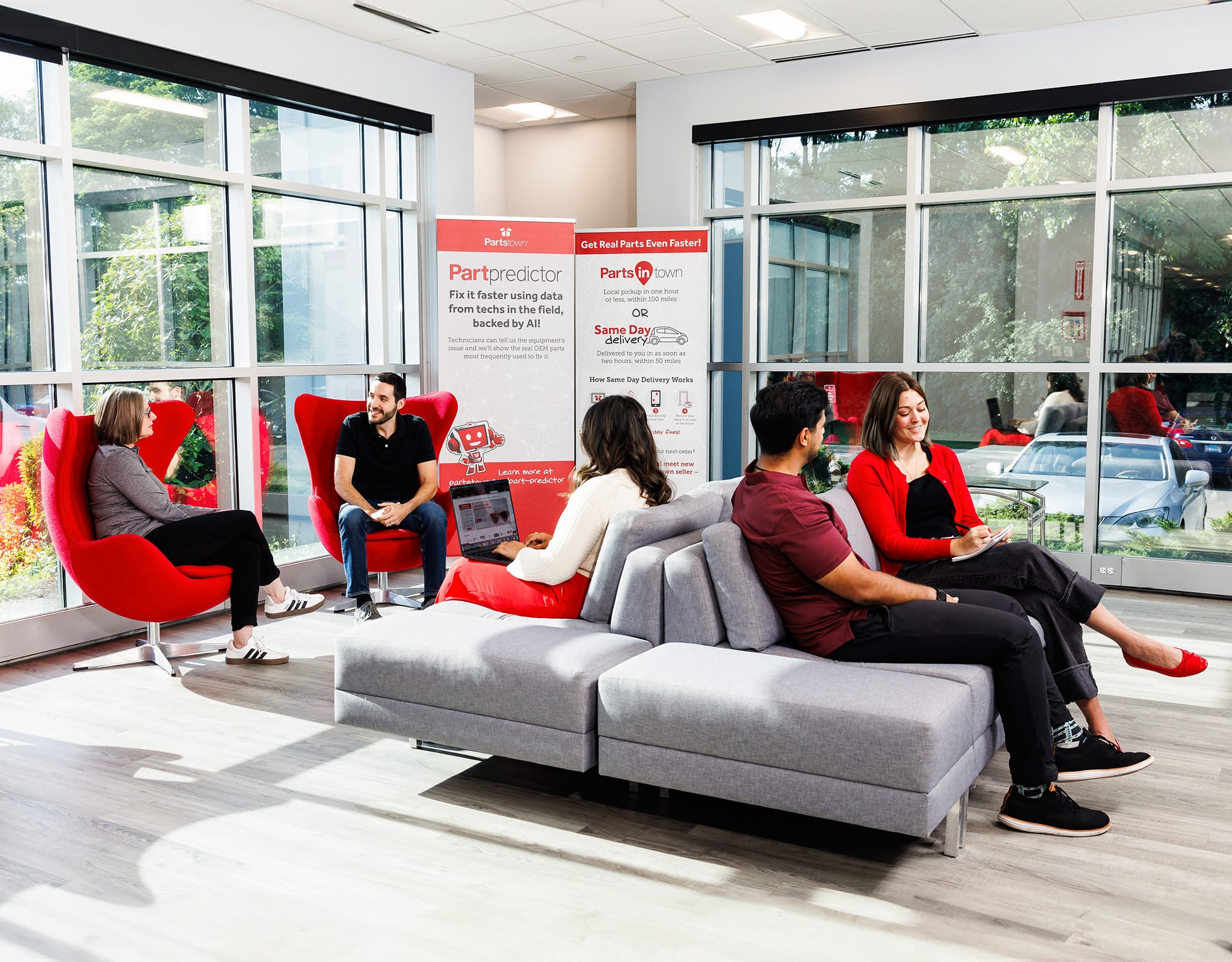 Chicago corporate lifestyle photography capturing a collaborative team discussion in a modern office lounge.