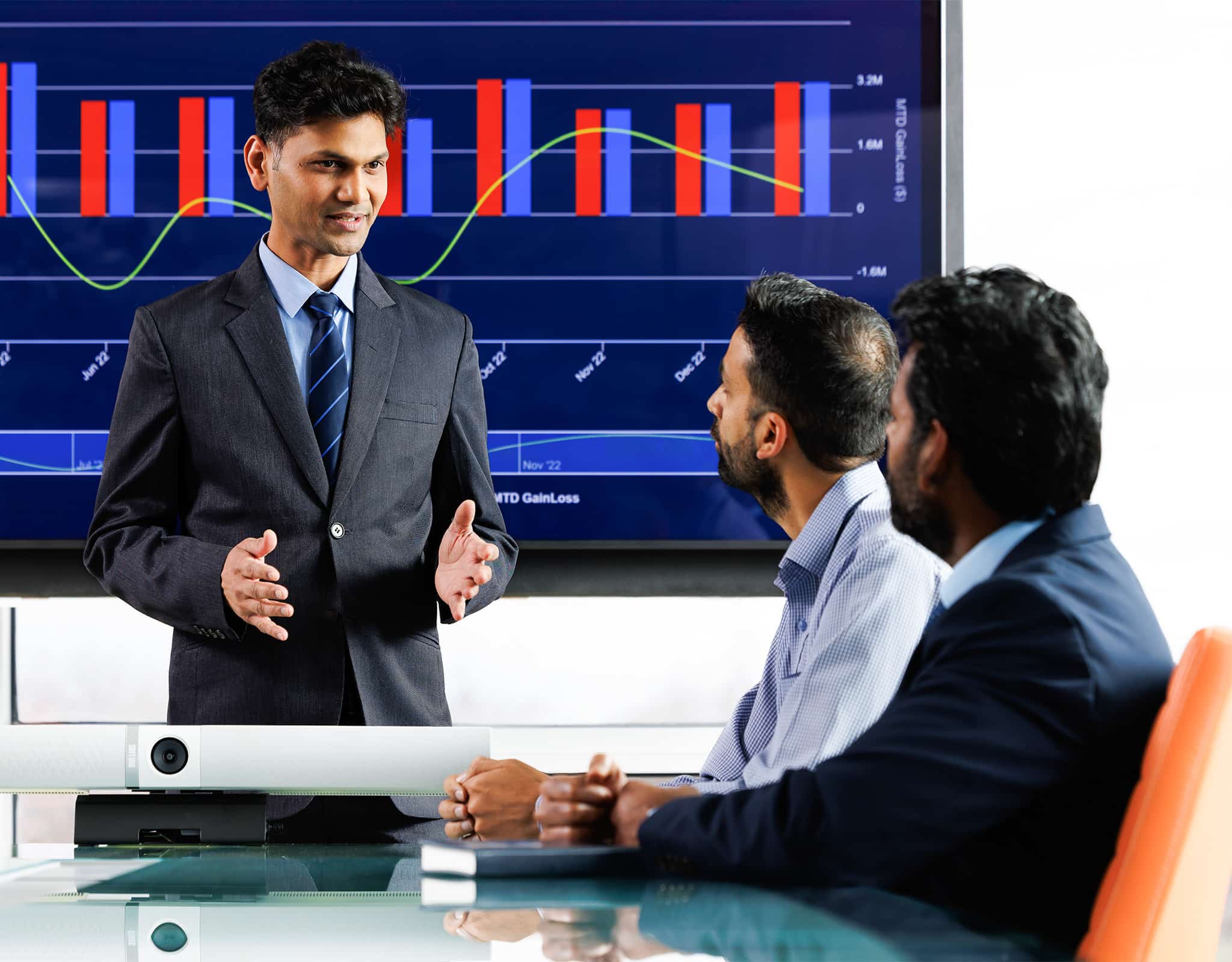 Chicago corporate lifestyle photography showing an executive presenting financial data to colleagues.