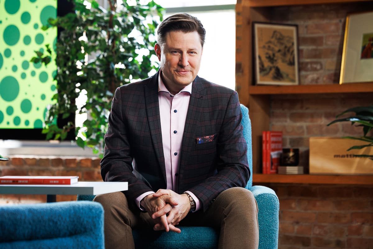 Business executive seated in an office environment during a professional branding session