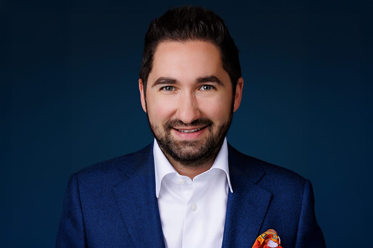 Professional headshot of an executive in a blue suit, photographed by Chicago corporate photographer Tori Soper.