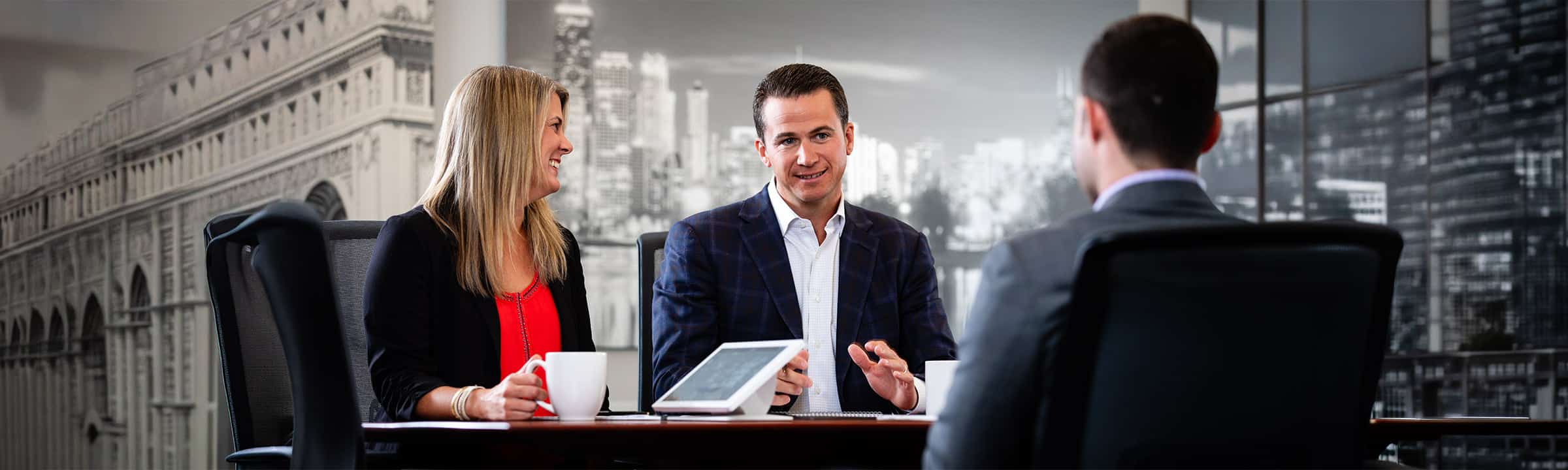 Corporate employees collaborating during a business meeting as part of a Chicago corporate lifestyle photography session.